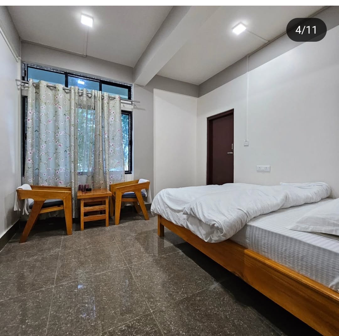 Cozy deluxe room at Khusimsim Mechuka homestay, ₹2000 double occupancy with valley views