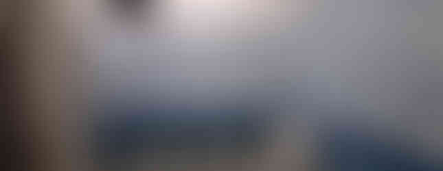 Scenic balcony view from Linya Homestay Aalo overlooking Siang Valley hills, affordable triple occup