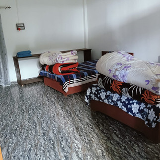 Book Kaji Lodge Anini at ₹2500 double occupancy via 8415076121, serene homestay entrance in Anini fo