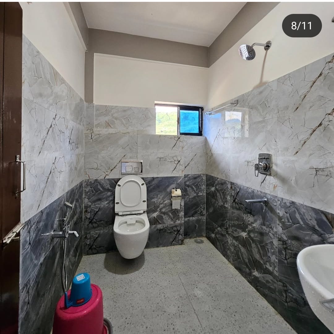 Khusimsim Mechuka homestay clean Western-style washroom with modern toilet and amenities