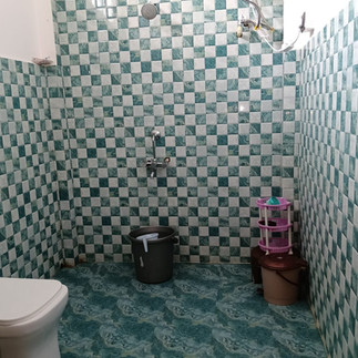 Lush garden courtyard of Kaji Lodge Anini, eco-friendly homestay in Dibang Valley with bamboo decor 