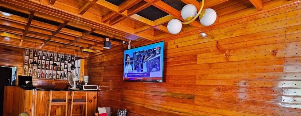 Warm fireplace and common seating area at Khusimsim Mechuka homestay for guest evenings