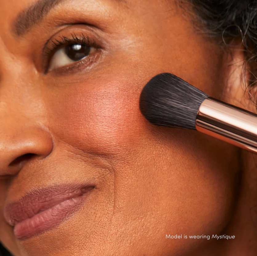 Thumbnail: A woman with a dark skin tone showing blush on her face.