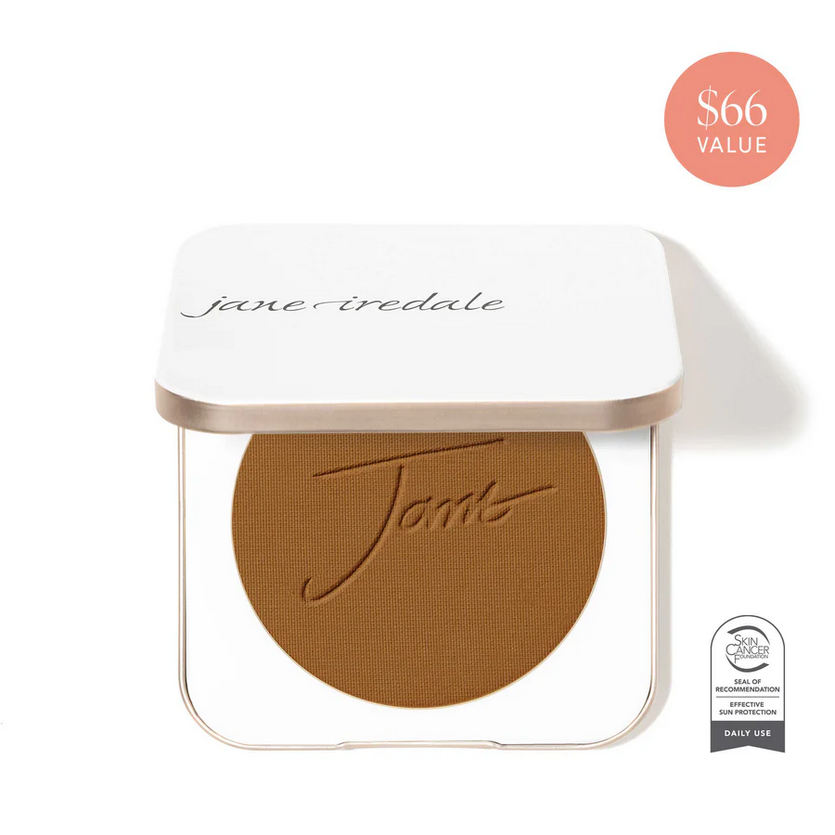 White make up compact containing a warm gold brown shade of face concealer.