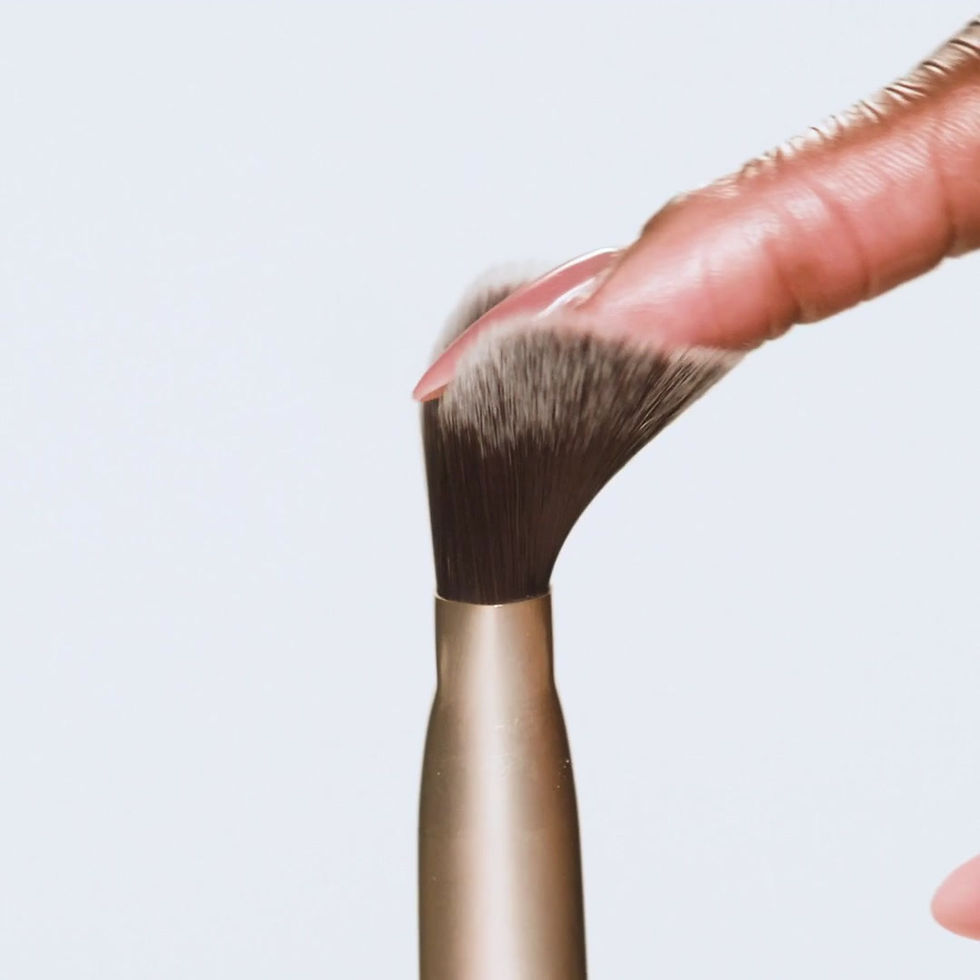 A video of a finger moving over the bristles of the brush.