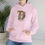Thumbnail: Pink Unisex Gildan 18500 Hooded Sweatshirt Personalized with name in Illuminated Letters. Georgie & Lexy Gifts & Home USA.