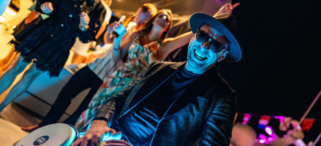 bongo player performing on a high end yacht party production