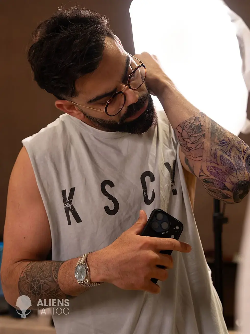 Virat Kohli checking stencil for his new tattoo sleeve during session at Aliens Tattoo
