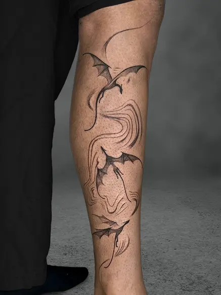 Leg tattoo featuring elegant dragons in flight with swirling patterns, minimalist black ink, male.