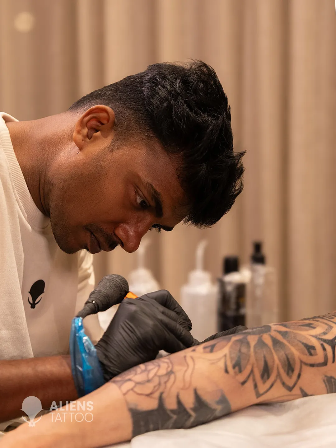 Devendra Palav detailing Virat Kohli new tattoo sleeve during session at Aliens Tattoo