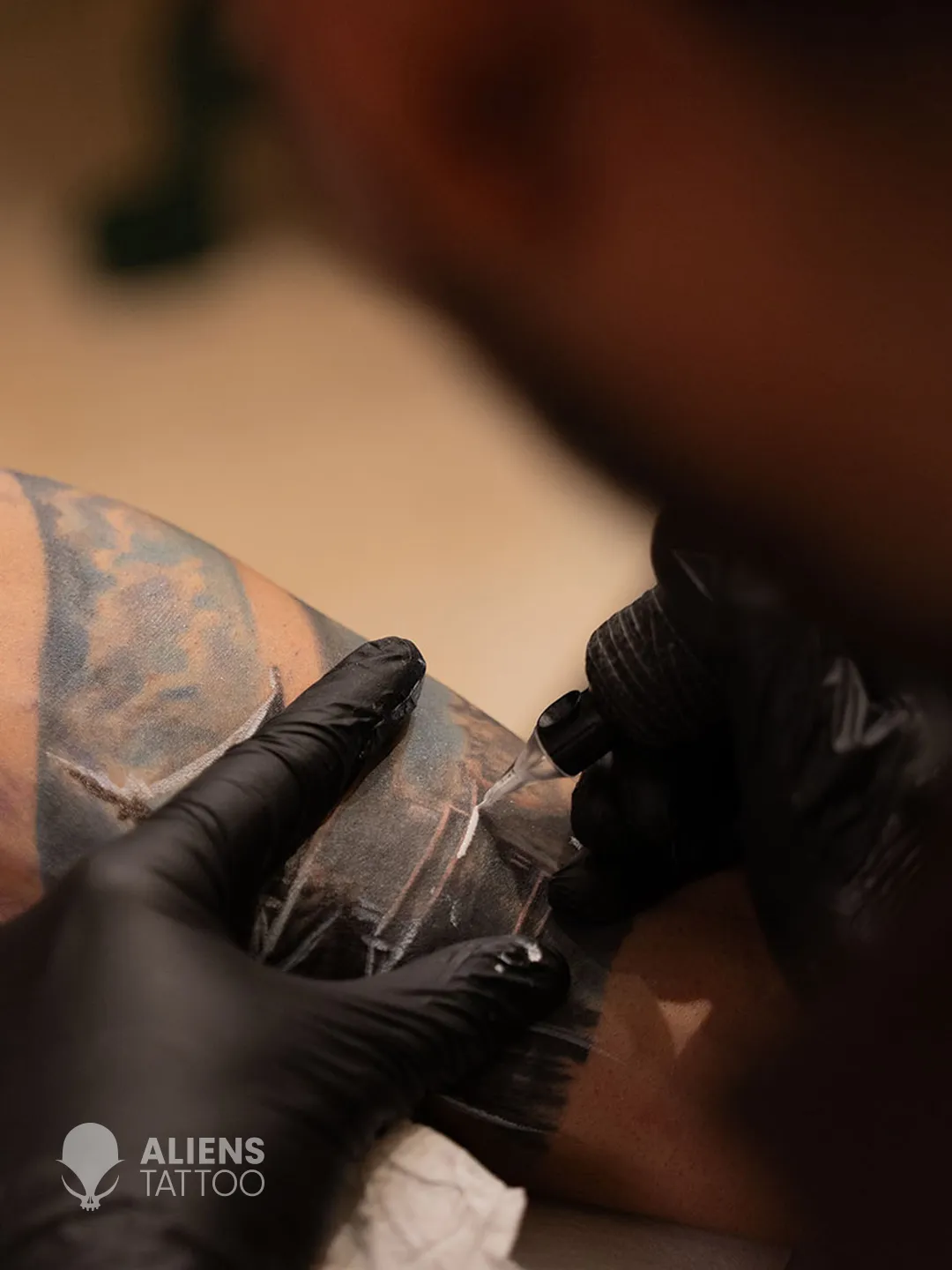 Close-up of Devendra Palav tattooing Virat Kohli new tattoo sleeve at Aliens Tattoo