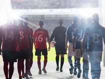 football players in red kit and blue kit