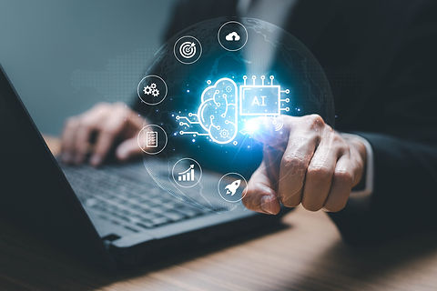 Oct 23 - Person on computer with icons of technology and Ai.jpg