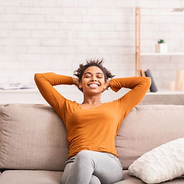 Woman smiling on the couch 