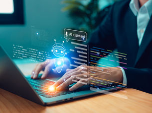 Businessman using laptop with interface and chatbot technology