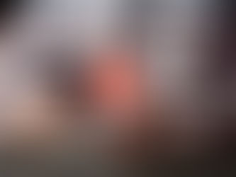 A man at a keyboard with a digital interface showing many notifications