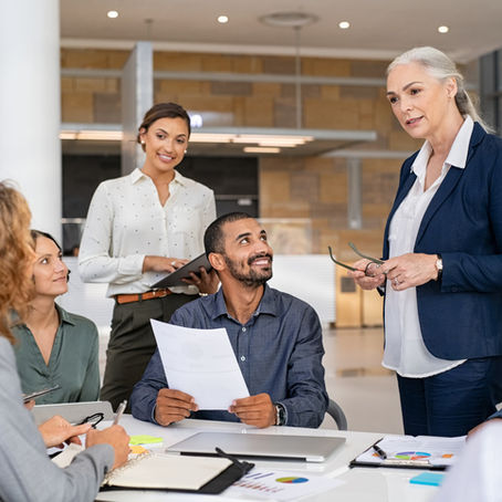 Multiethnic business team in meeting at modern board room