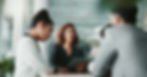 People having a meeting around a table in an office