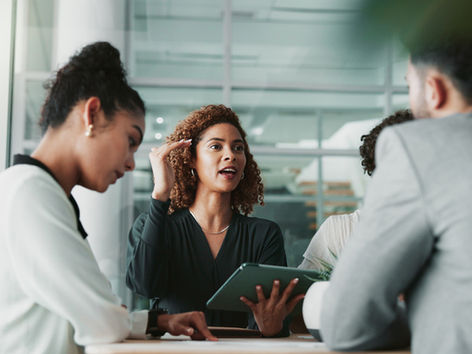 People having a meeting around a table in an office