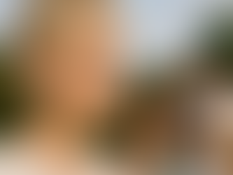 A boy is disconnected from his family. He has an AirPods in his ear.