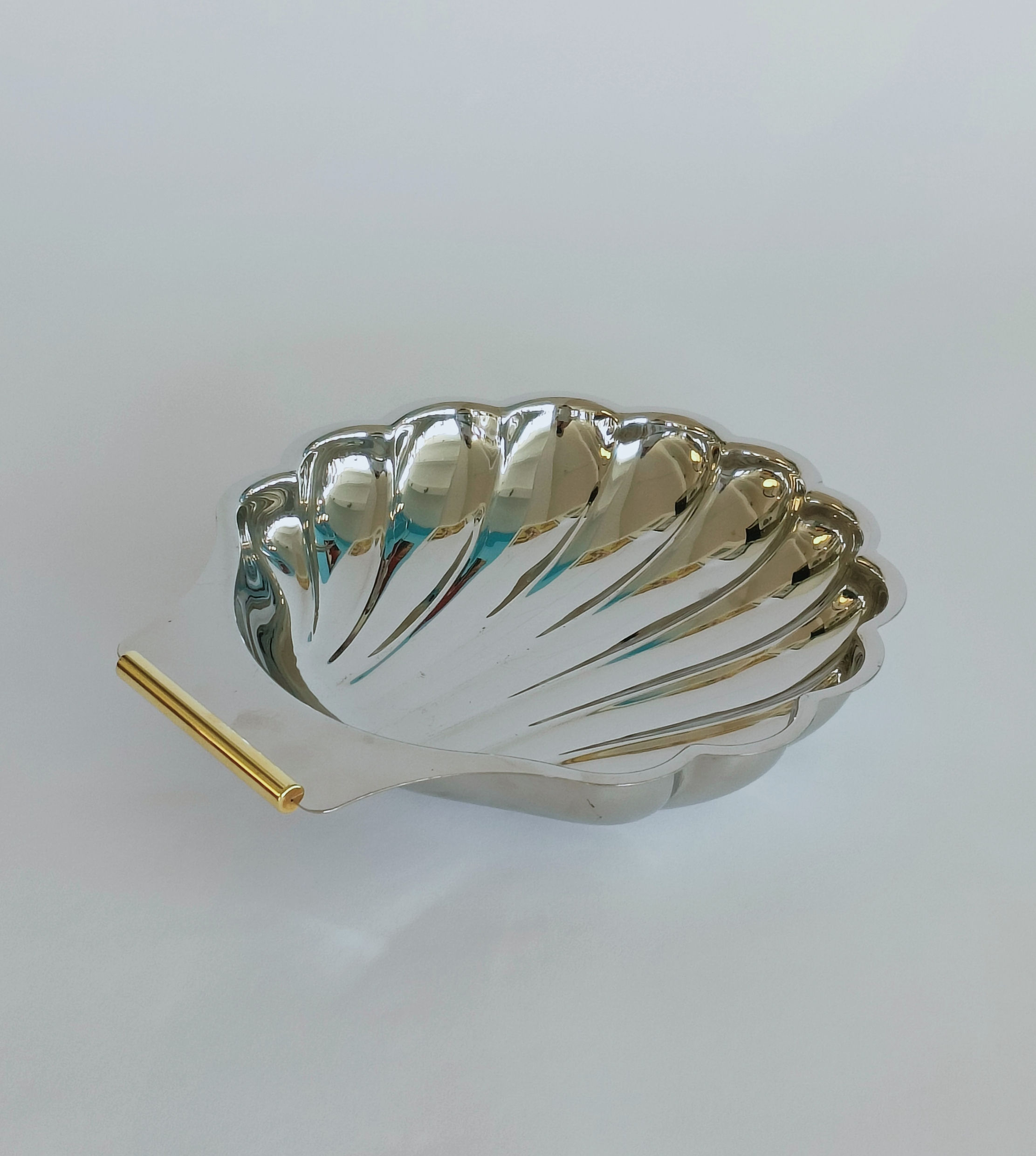 Silver shell dish with a golden touch