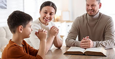 family-with-bible-praying-at-table-indoors-2025-12-01-15-46-42-utc.jpg