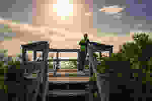 Image of a person spending time at a coastal viewing platform