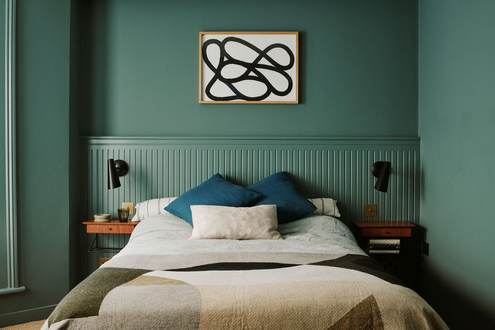 bedroom interior with oval blue walls and bed panelling design