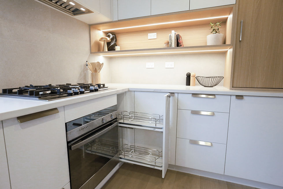 Modern kitchen with open cabinets showing metal racks, a gas stove, and lower oven. Light wood accents, neutral colors, tidy and minimalistic.