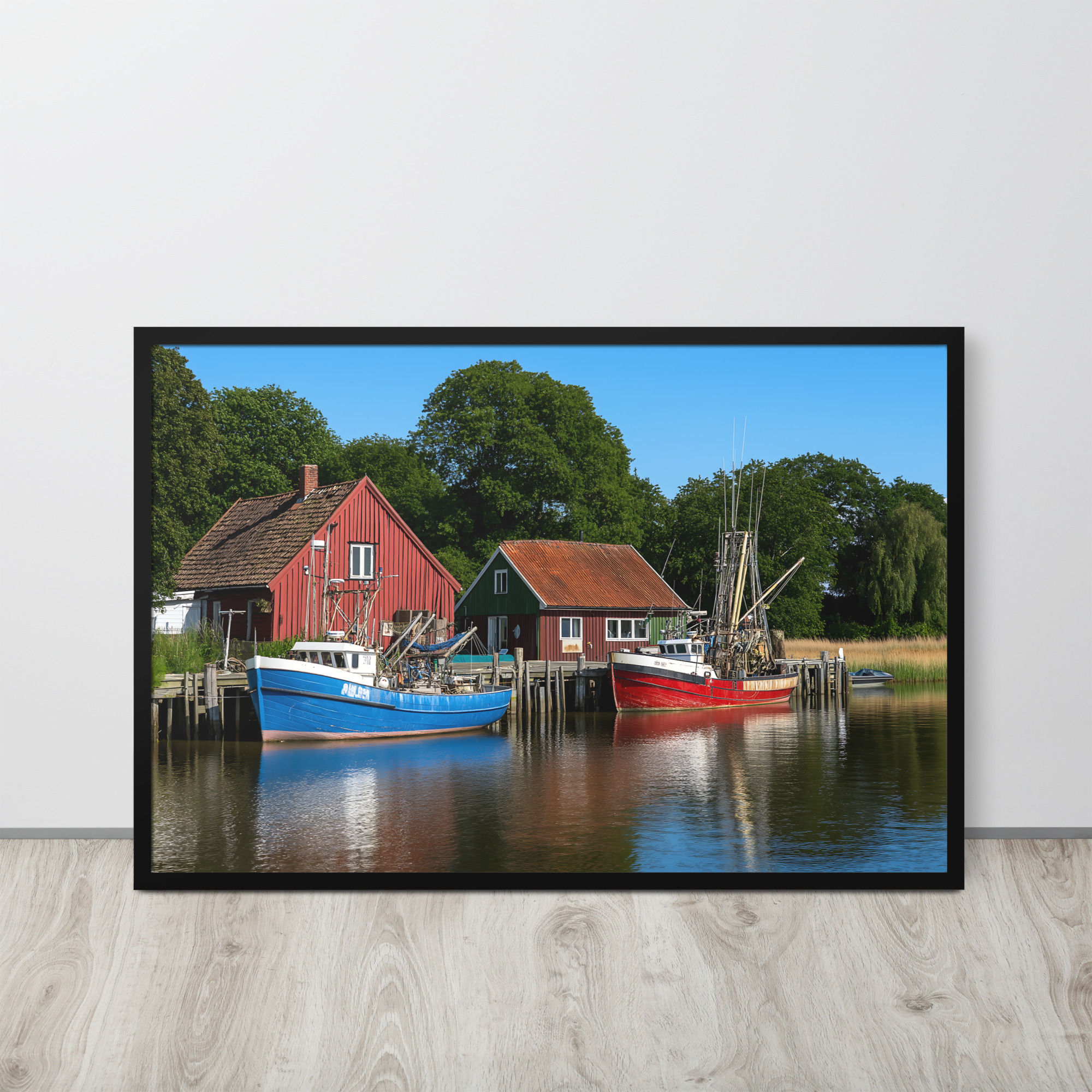 Boats docked by red buildings