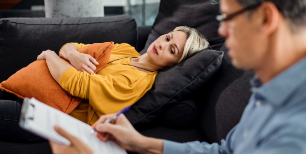 Woman laying during psychiatry appointment