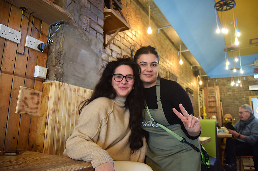 Gabby and her friend she made from frequent café visits