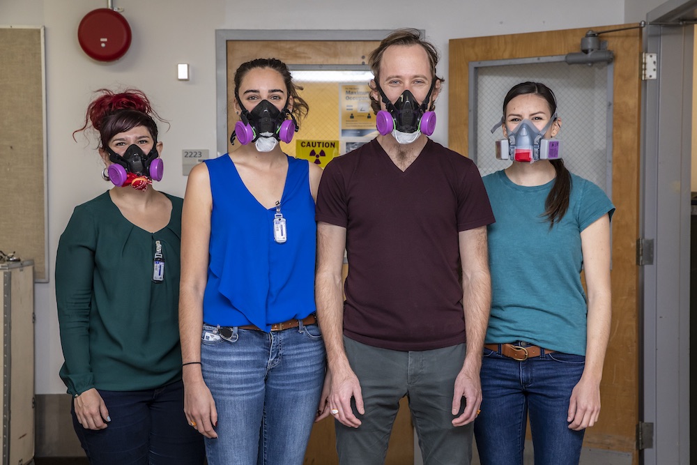 Berkeley Lab scientists Leticia Arnedo-Sanchez (from left), Katherine Shield, Korey Carter, and Jennifer Wacker had to add respirators to their toolkit to protect against coronavirus to conduct experiments with the rare element, einsteinium. (Credit: Marilyn Sargent/Berkeley Lab)