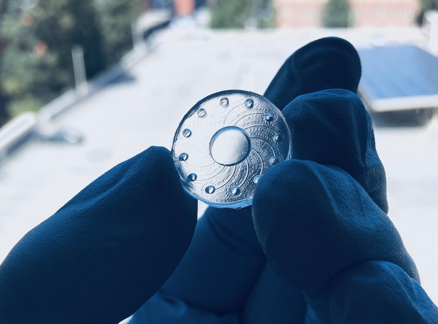 Enlarged prototype of biosensor lens with reservoirs.