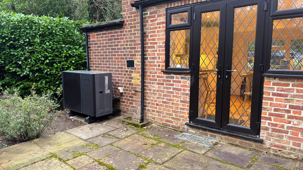 Air source heat pump installed outside a home eligible for the £9,000 grant