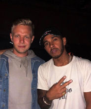 Kevin Magnussen and Lewis Hamilton at the GR1D CLUB Barcelona
