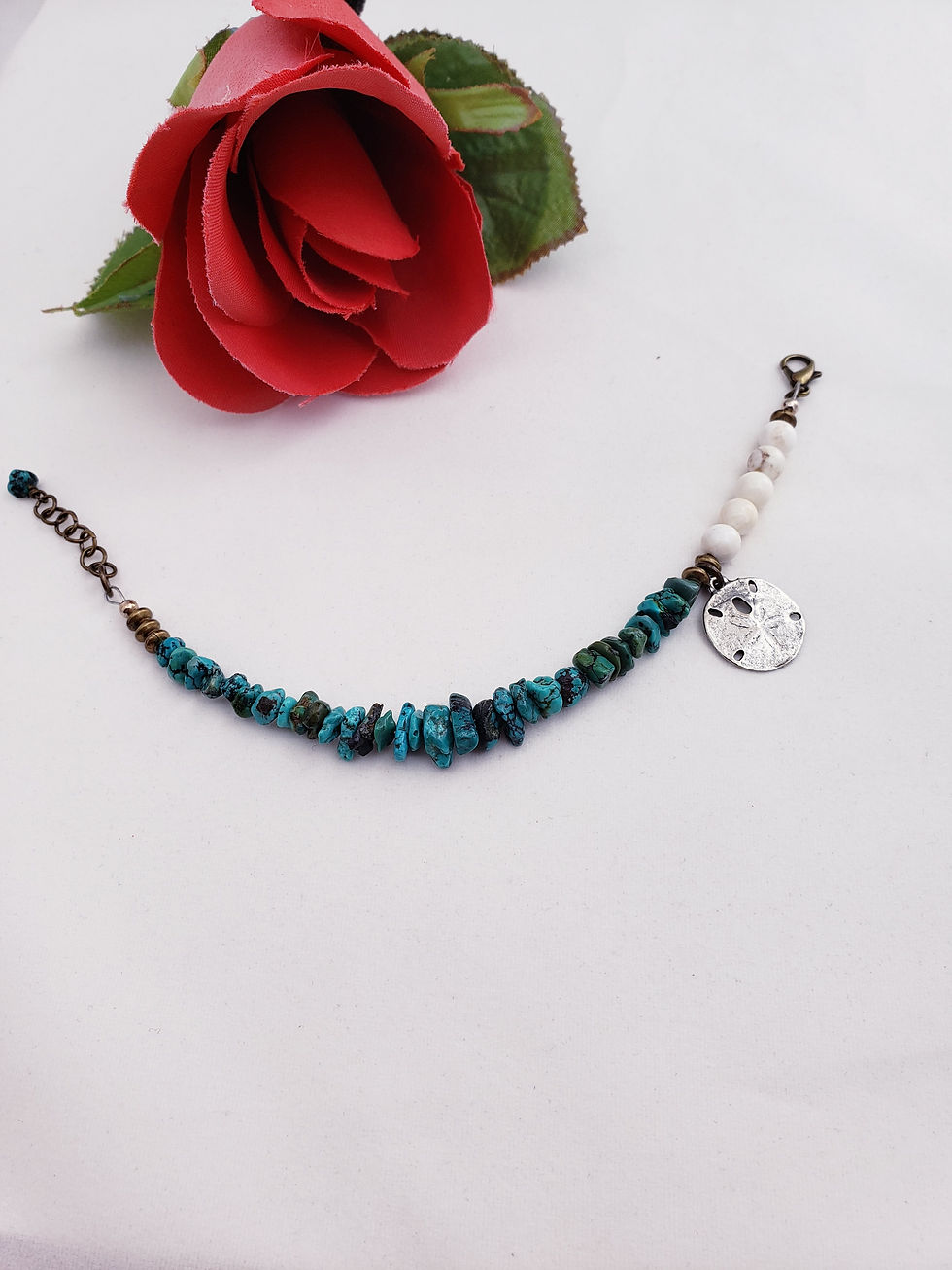 Thumbnail: asymmetrical turquoise bracelet with sand dollar