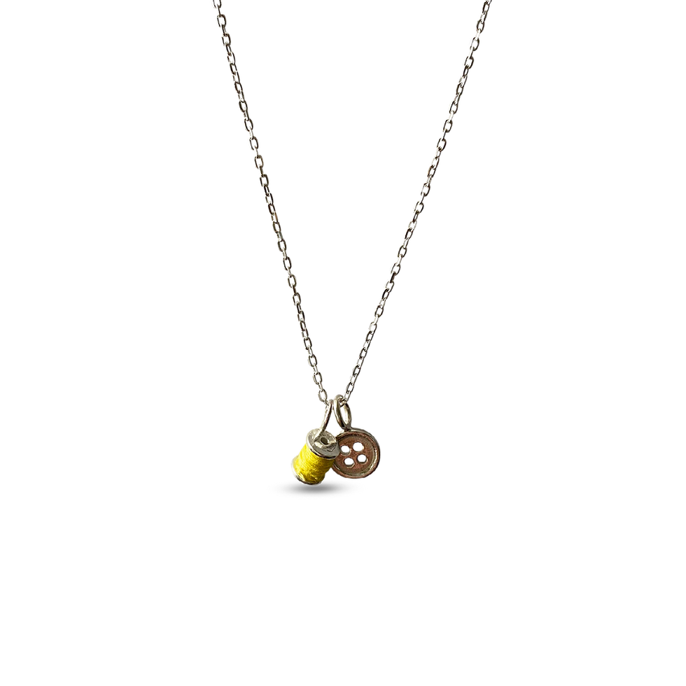 Thumbnail: Cotton reel and button necklace