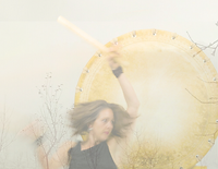 Woman moving with big drum