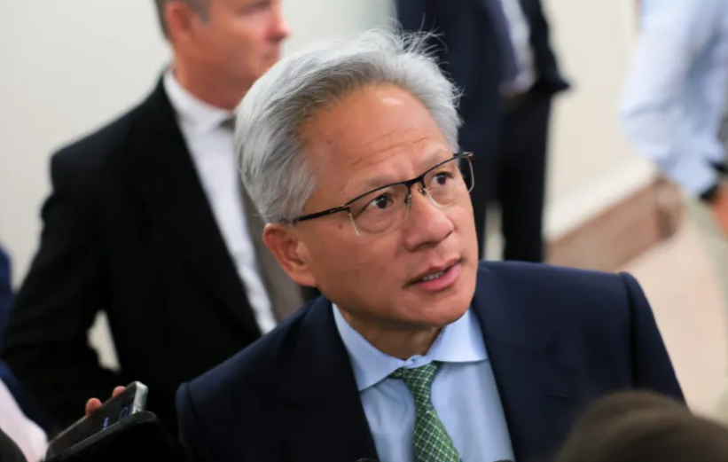 Nvidia’s CEO says AI adoption will be gradual, but when it does hit, we may all end up making robot clothing