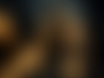 A modern person in everyday clothes (jeans, jacket) standing confidently, with a faint transparent overlay of glowing armor barely visible