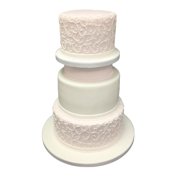 Three-tier wedding cake with intricate pink and ivory sugar paste scrollwork.