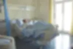 woman lying in a hospital bed
