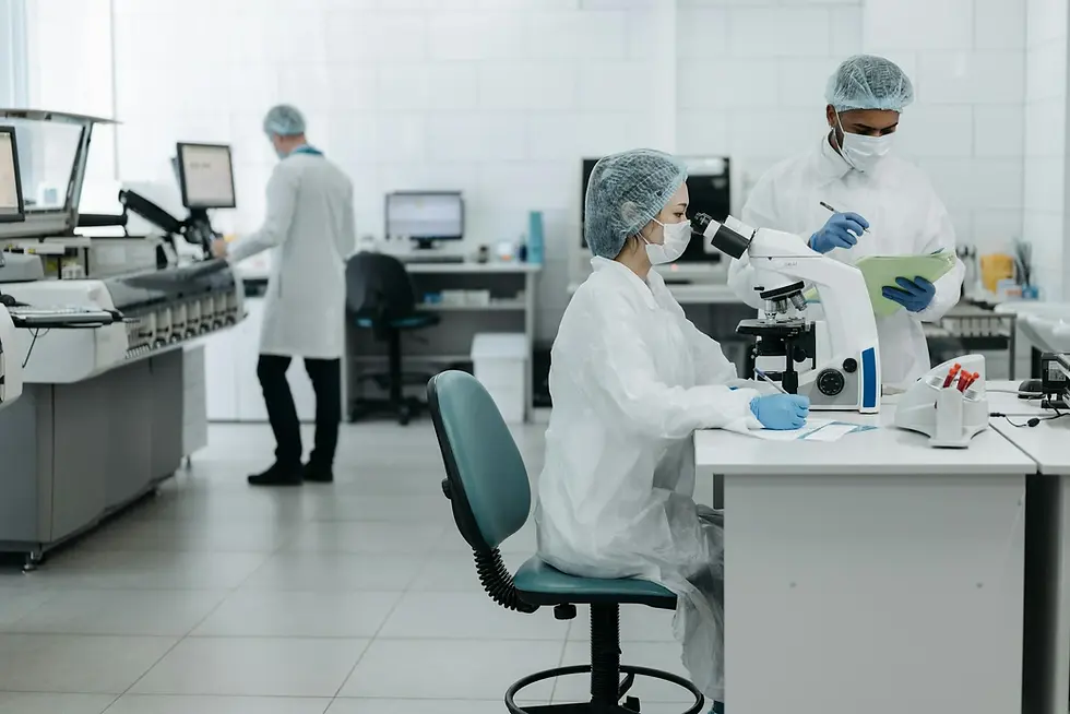 Woman scientist looking through a microscope.