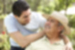Senior Man With Adult Son In Garden