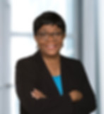 Smiling, proud female owner, arms folded in professional photo