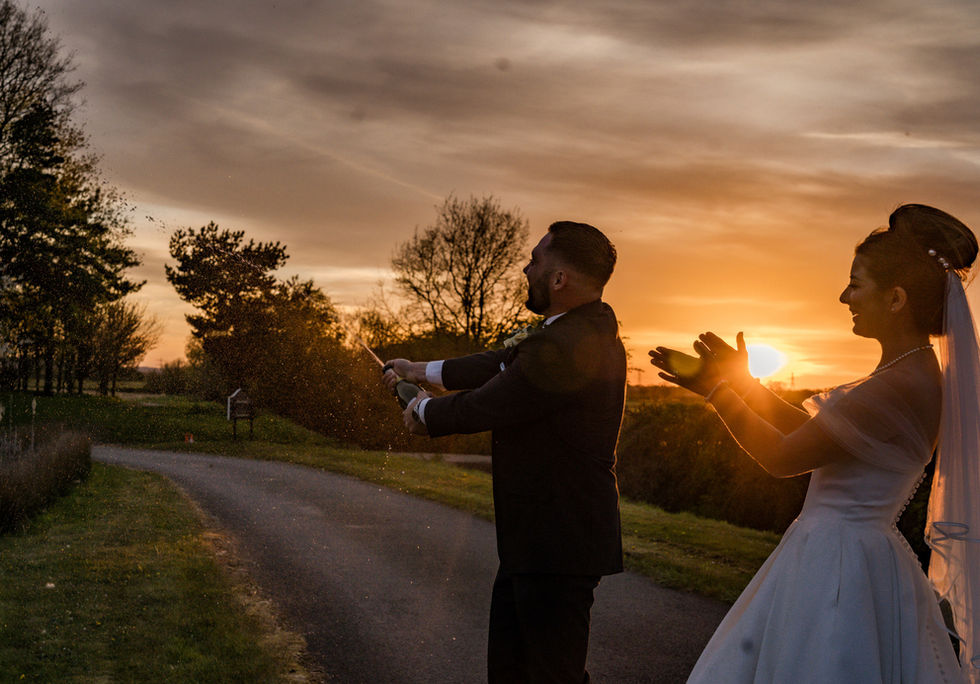 Couple celebrating sunset wedding