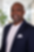 Professional headshot in modern office.png