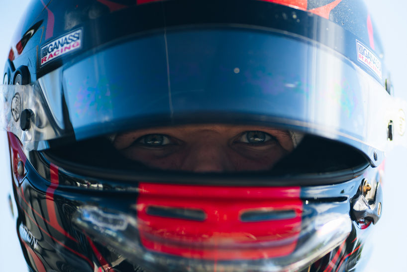 Bryce Aron Chip Ganassi Number 9 Car in Helmet with visor open