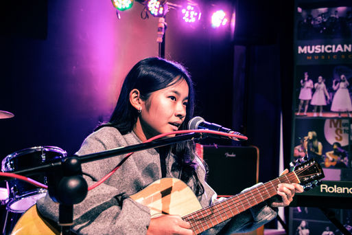 Musician Story Music School Guitar class performance 